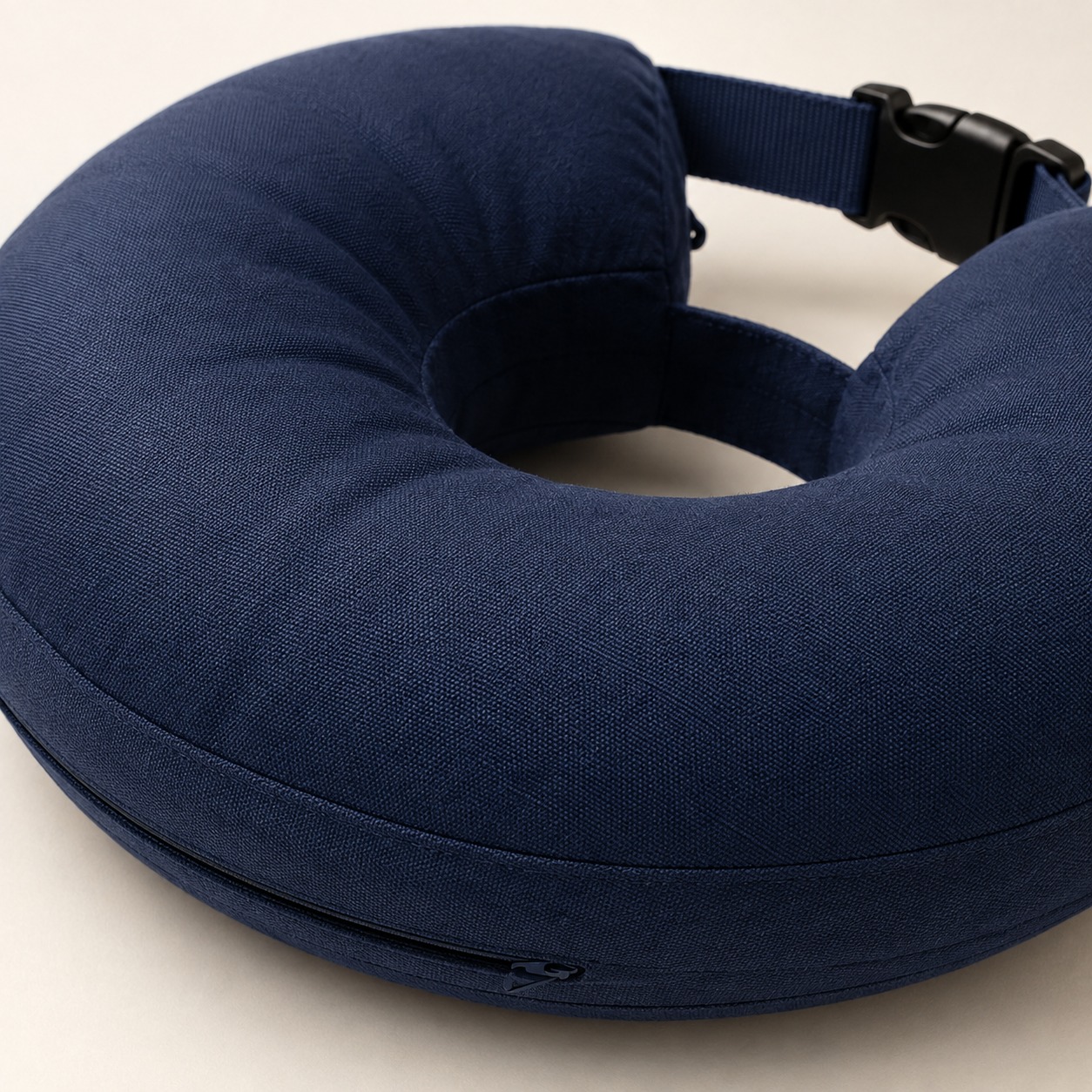 Close-up of navy inflatable recovery collar fabric zipper and buckle