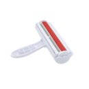 White and red reusable self-cleaning pet hair remover roller on white background
