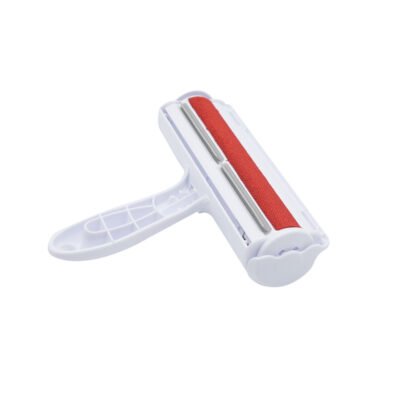 White and red reusable self-cleaning pet hair remover roller on white background